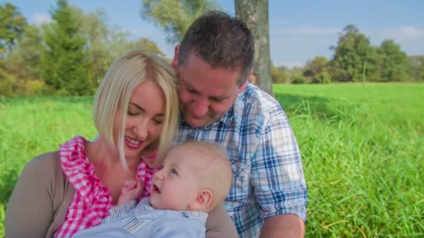 Young couple is enjoying the new-born son — Stock Video