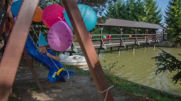 Children coming on to the b-day party over the bridge — Stock Video