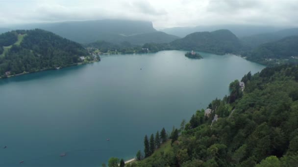 Flying above lake with small island — Stock Video