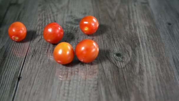 Tomatoes on wooden table — Stock Video
