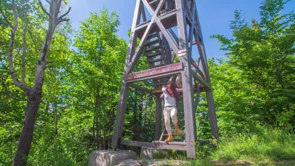 Couple on hunting tower  observing  nature — Stock Video