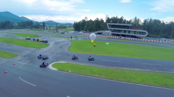 Go cards racing who cornering and overtaking on racecourse — Stock Video