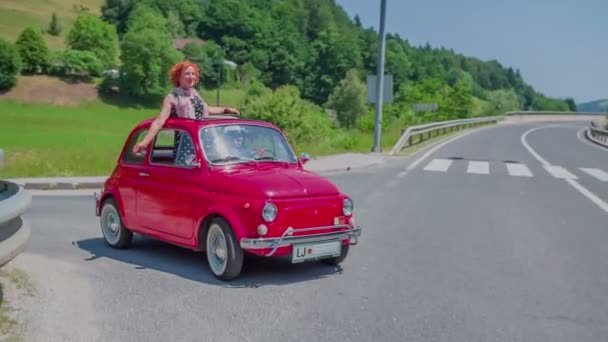 Red yugo pulls back up to the main road — Stock Video