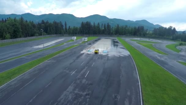 Driver training on wet court in polygon — Stock Video