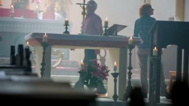 Christian couple is walking around the altar