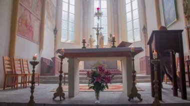 Christian couple is walking around the altar