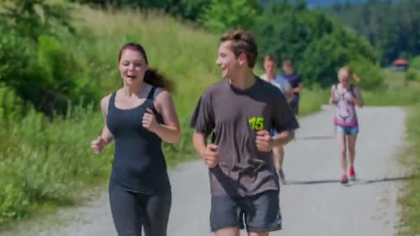 Couple is running together and is enjoying the jogging — Stock Video