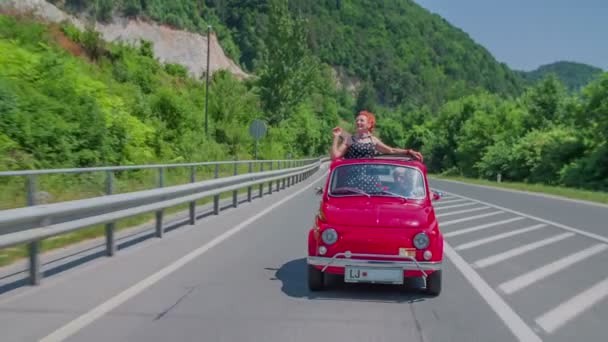 Red yugo goes through traffic lights — Stock Video