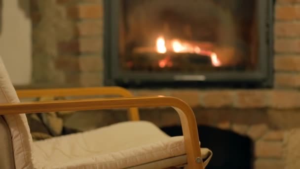 Chair infront of  fireplace — Stock Video