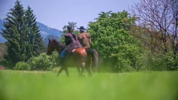 Two people riding horses — Stock Video