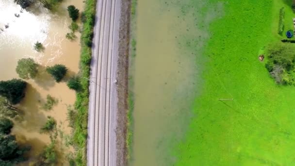 Railway flying with river water flooding around — Stock Video