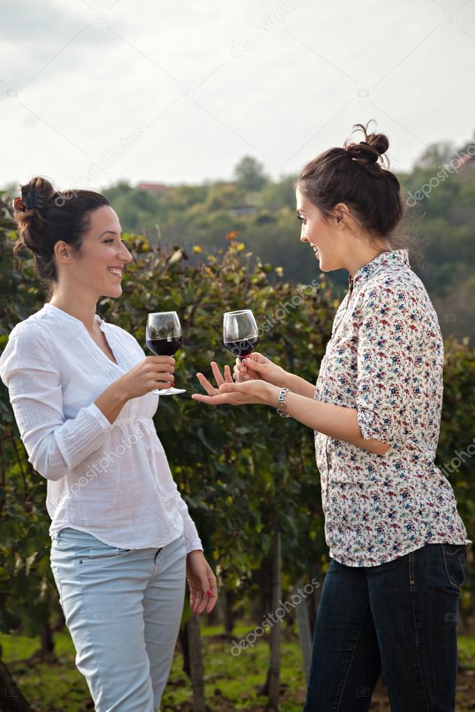 Two Young Women Drinking Wine