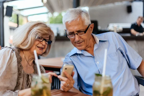 Mature Couple In Cafe Using Technology — Stock Photo, Image