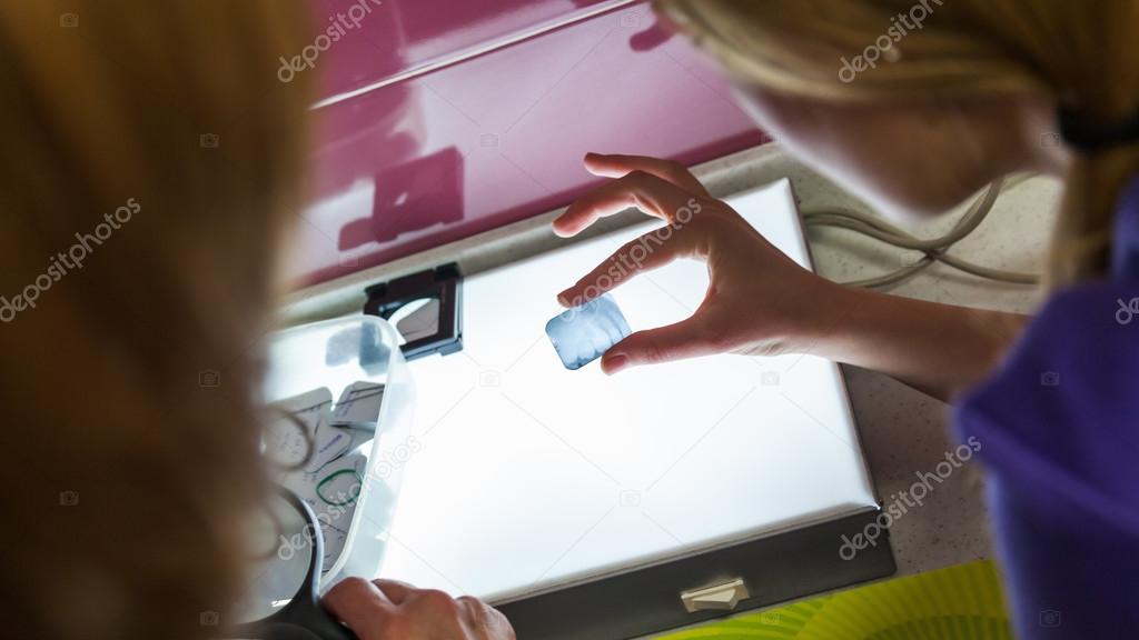 Two Female Dentist Looking At X-ray Image