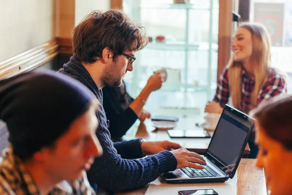 Young Man Using Laptop In Cafe — Stock Photo, Image