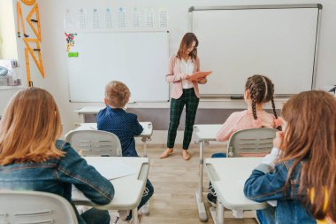 Elementary school students at lesson in the classroom