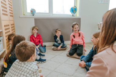 Elementary school students talking in the classroom
