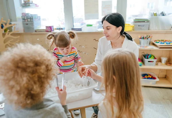 Children Playing Kindergarten Teacher Preschool Students Looking Letter Forms Container — 스톡 사진