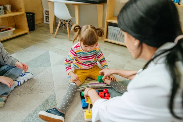 Preschool Students Sorting Wooden Geometric Toy Balls Cubes Sittings Floor — Stock Photo, Image