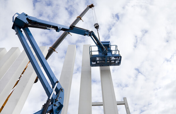 Building under construction. Columns. Cranes