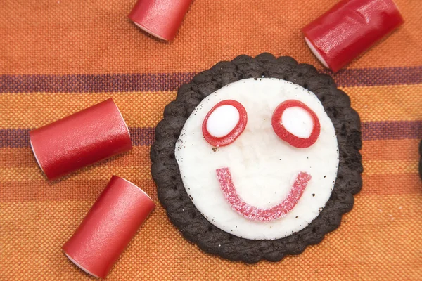 Smiling and funny cookies with sweets — Stock Photo, Image