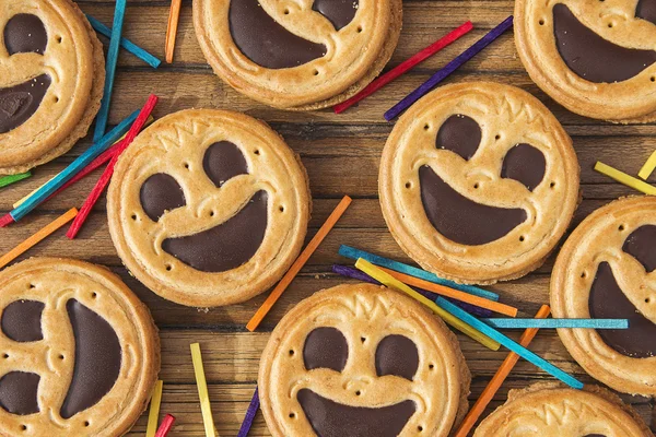 Round smiling chocolate cookies with colour confeti — Stock Photo, Image