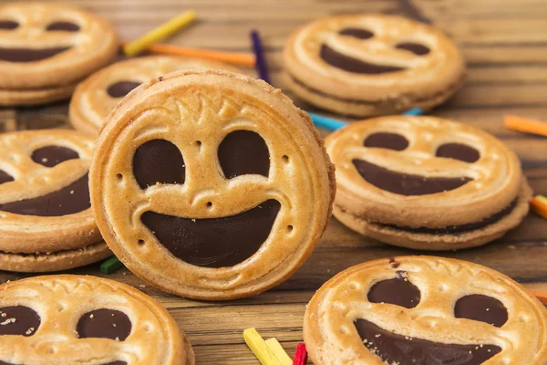 Round smiling chocolate cookies with colour confeti — Stock Photo, Image