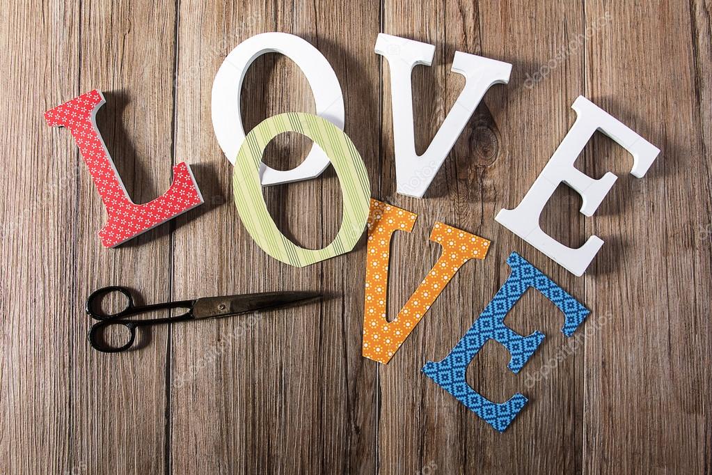 Decorating Wooden Love Letters With Vintage Papers Stock Photo