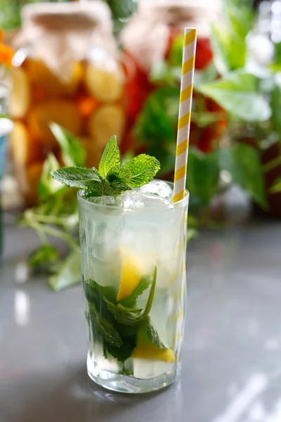 Mojito drink with rum, fresh mint, lime, ice, and waterRefreshing drink, culinary photography.