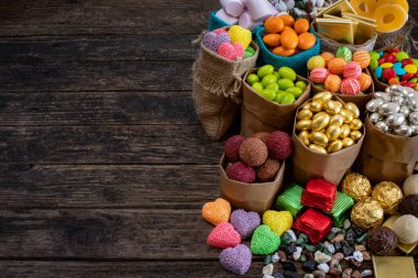 Many types of chocolate and sweets on the table