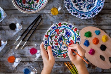 Handmade tile ceramic painting lesson. Art course lesson concept. 