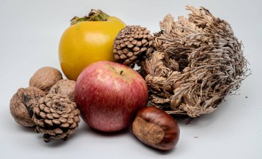 A composition of typically autumnal fruits such as chestnuts, walnuts, persimmons or the Campanian Annurca apple, enhancing their beauty and detail.