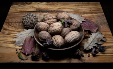 A composition of typically autumnal fruits such as walnuts, enhancing their beauty and detail
