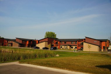 Oshkosh, Wisconsin USA - September 20th, 2025: Brick modern style apartment buildings being used by people of the community.