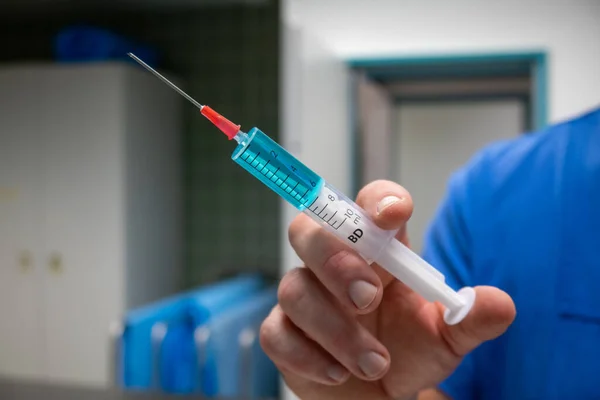 Syringe Filled Blue Liquid One Hand — Stock Photo, Image