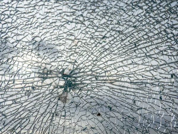 a cracked safety glass produces a filigree pattern