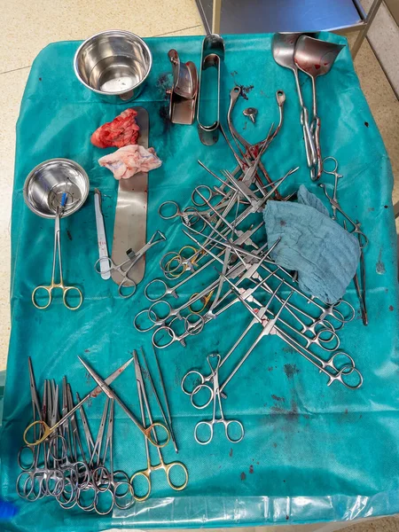 on an operating table lie used surgical instruments after a cesarean section