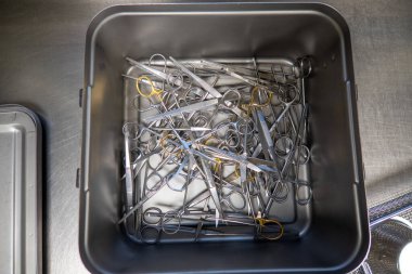 in the sterilization department in an operating room, instruments are sorted and cleaned 