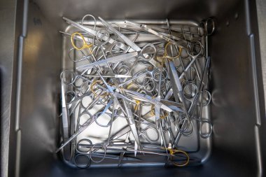 in the sterilization department in an operating room, instruments are sorted and cleaned 