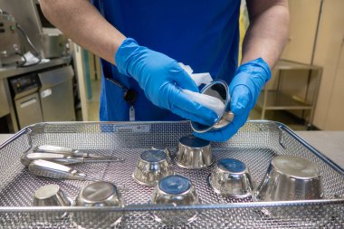 in a sterilization department in an operating room, instruments are sorted and cleaned 