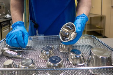in a sterilization department in an operating room, instruments are sorted and cleaned 