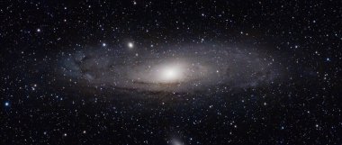 A stunning high-resolution photograph of the Andromeda Galaxy (M31), showcasing its magnificent spiral arms, glowing galactic core, and countless surrounding stars. This breathtaking deep space image captures the vastness and beauty of the universe, 