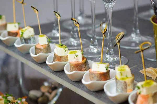 Catering service. Snacks for guests on the table.