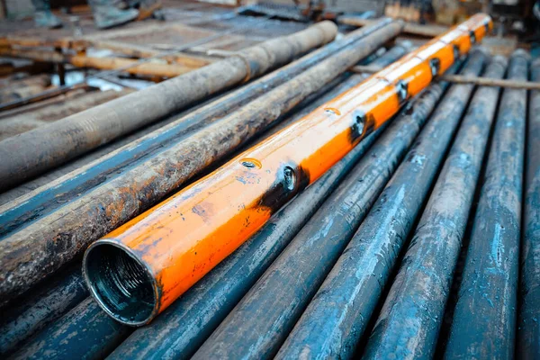 Perforation tool for perforate oil and gas well to make the hole on production tubing to allow gas and condensate flow. Close up image of perforated gun carrier. Perforating gun swelling after firing.