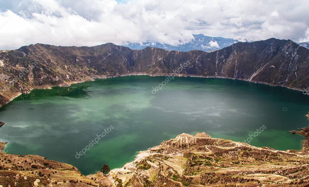 The turquoise volcano crater lagoon of Quilotoa along the famous hike called Quilotoa Loop near Quito, Ecuador.
