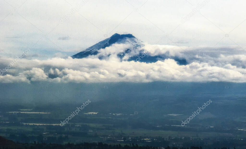 Tungurahua Volcano  with misty Valley of Latacunga, Ecuador
