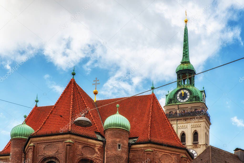 The church of St. Peter, called Old Peter, with tourists on the tower.Oldest parish church in Munich(Bavaria, Germany). The building of the church was extending over several centuries.