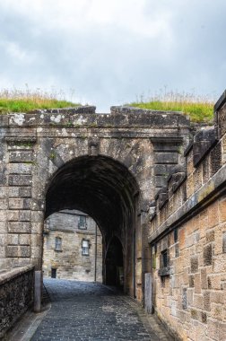 The main entrance to Stirling Castle in Scotland. Built around the year 1500AD, the main entrance allows access through the outer defence wall into the tourist reception area with its shop and cafe.