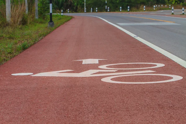 Bicycle road sign on asphalt — Stock Photo, Image