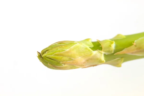 Verse groene asperges op achtergrond — Stockfoto